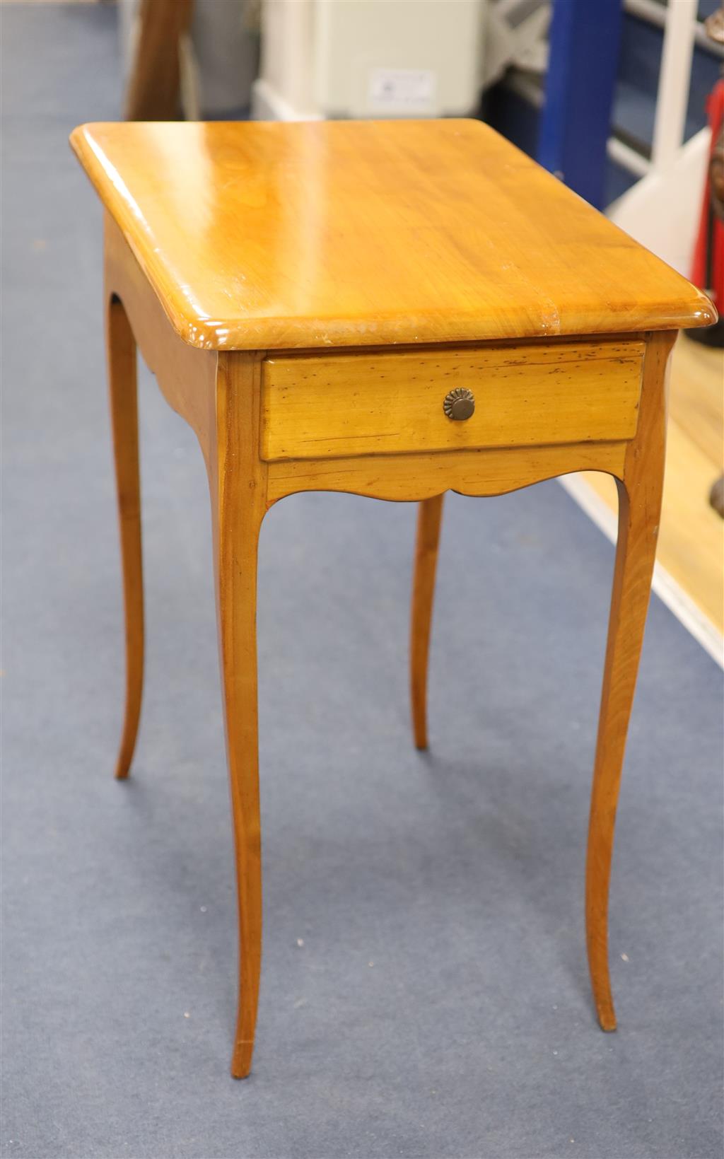 A 19th century Biedermeier cherrywood side table, fitted with a single drawer, raised on cabriole legs